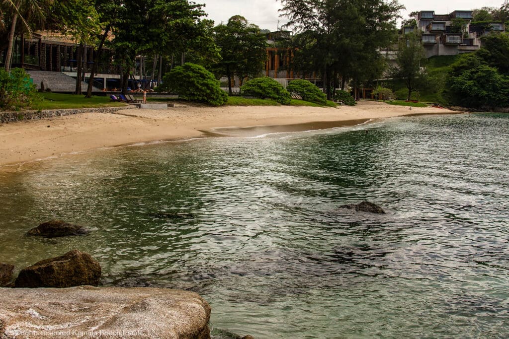 Secluded Yae Beach in Phuket with calm waters and lush greenery.