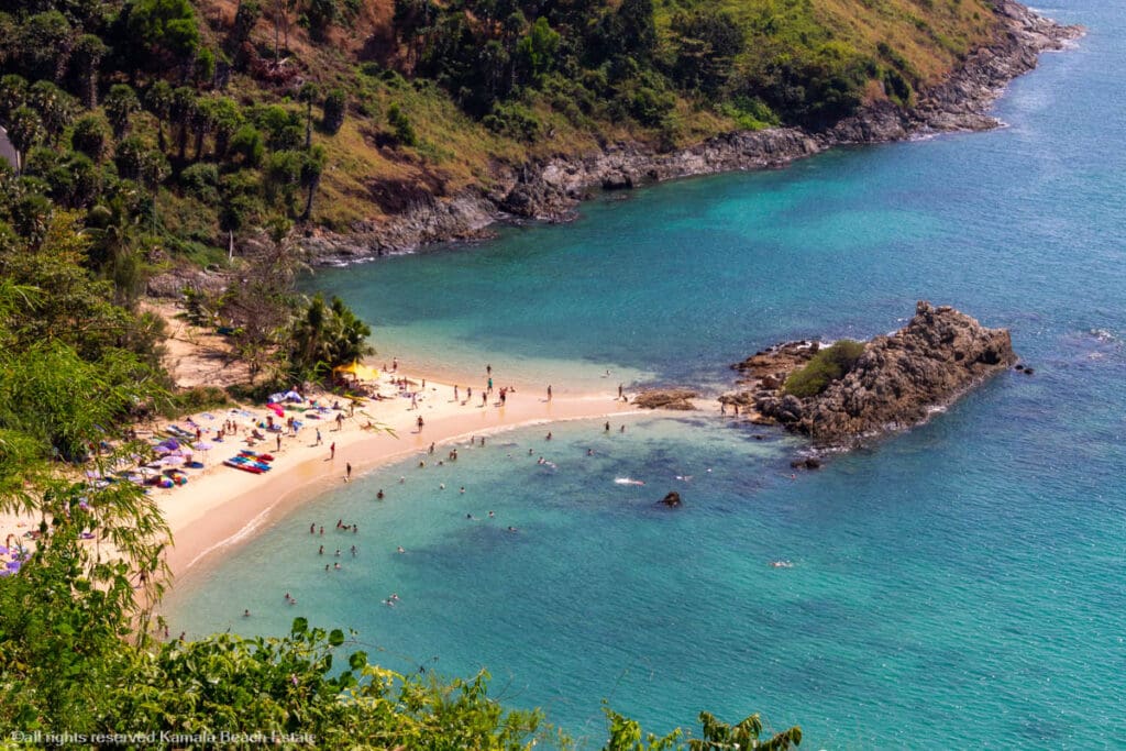 Top Beaches Phuket Aerial view of Yanui Beach with clear blue waters and surrounding greenery.