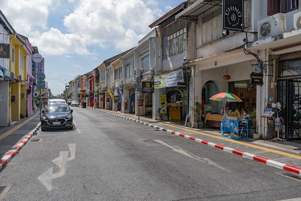 A view of the vibrant streets of Phuket Old Town, showcasing its unique blend of Sino-Portuguese architecture, colorful shophouses, and modern street life.